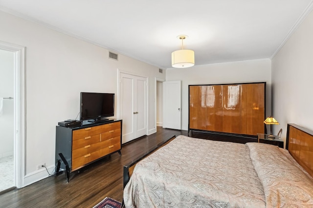 bedroom featuring dark hardwood / wood-style flooring