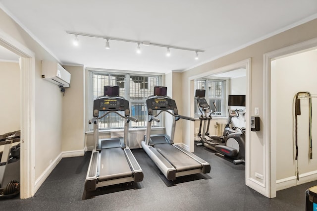 exercise area featuring an AC wall unit and crown molding