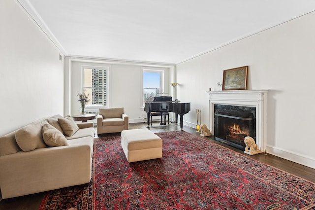 living room with hardwood / wood-style flooring and crown molding