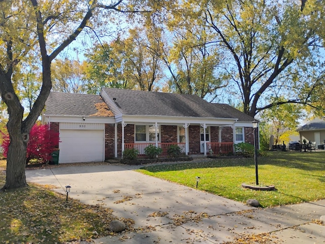 ranch-style house featuring a front lawn, a porch, and a garage