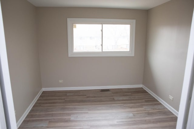 unfurnished room featuring light hardwood / wood-style flooring