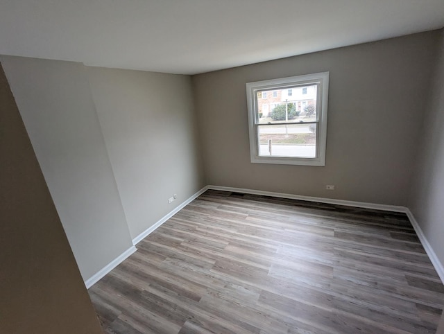 spare room with light hardwood / wood-style flooring