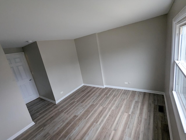 unfurnished room featuring hardwood / wood-style flooring