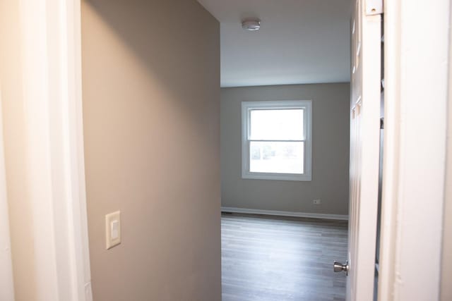 empty room featuring dark wood-type flooring