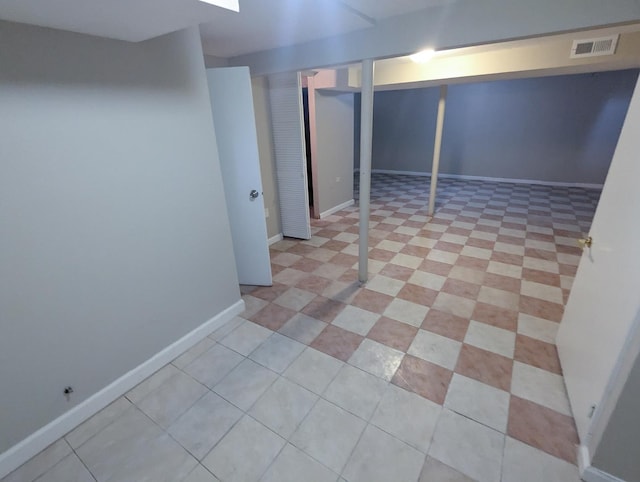 basement with light tile patterned floors