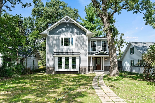 view of property featuring a front lawn