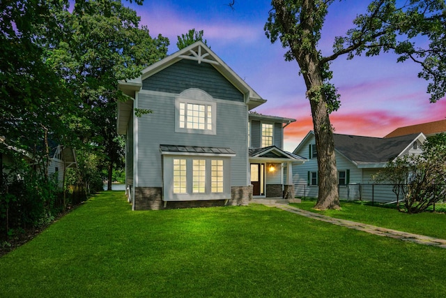 back house at dusk with a yard