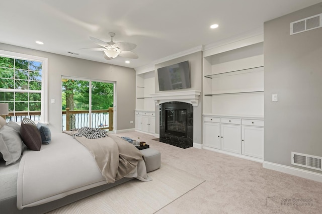 carpeted bedroom with ceiling fan and access to outside