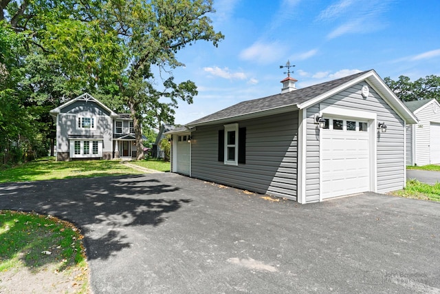 garage with a yard