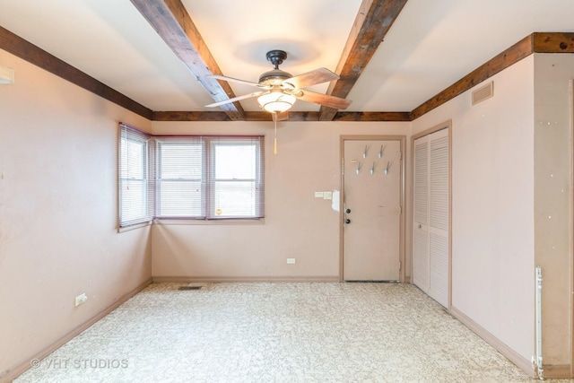 interior space with ceiling fan