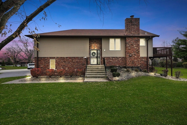 view of front of home with a lawn