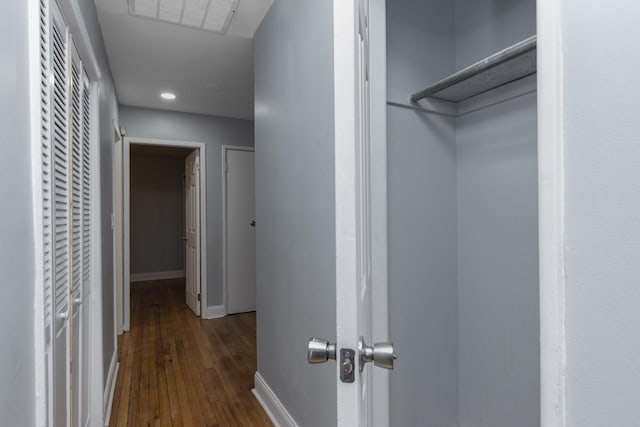 hallway with dark wood-type flooring