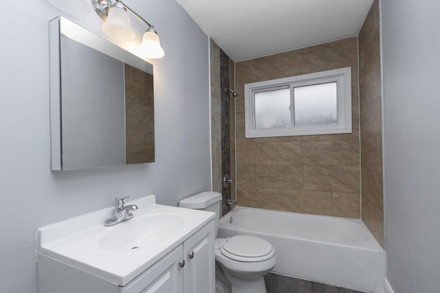 full bathroom with toilet, vanity, and tiled shower / bath combo