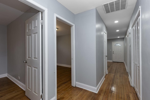 hallway with wood-type flooring