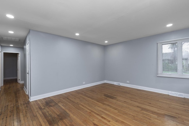 unfurnished room with hardwood / wood-style floors