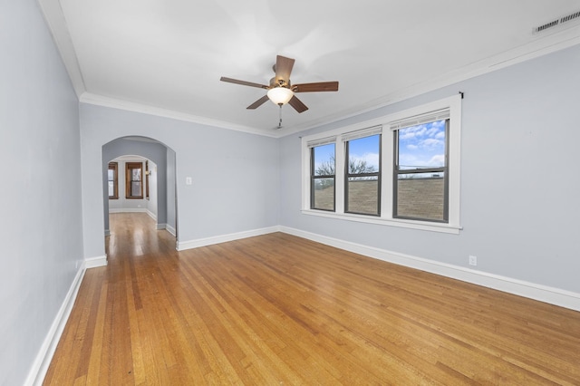 unfurnished room with crown molding, ceiling fan, and light wood-type flooring