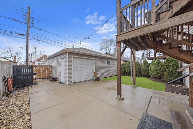 view of patio / terrace featuring an outdoor structure and a garage