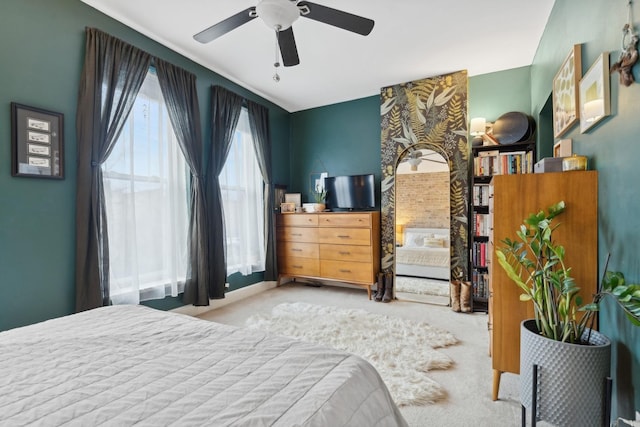 bedroom with light colored carpet and ceiling fan