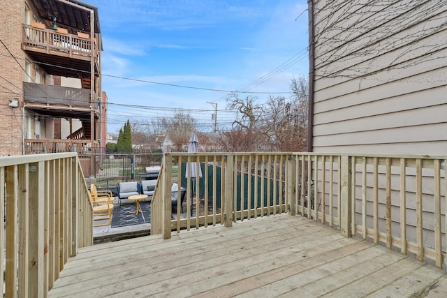 wooden terrace with outdoor lounge area