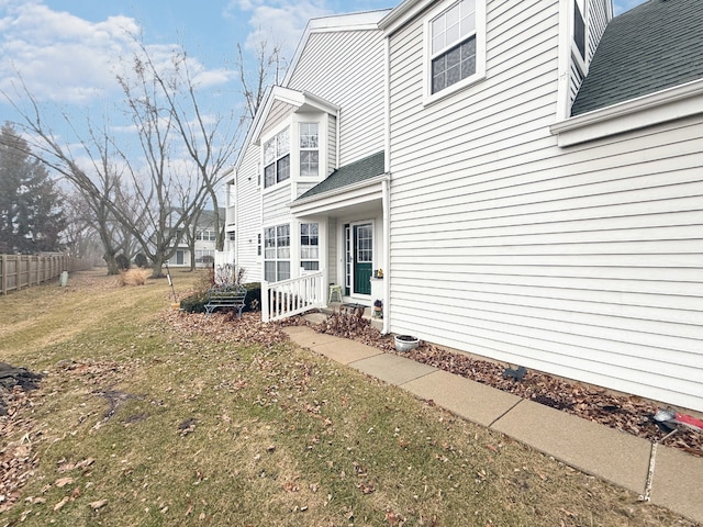 view of home's exterior with a yard