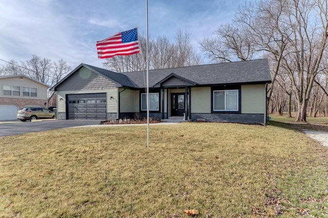 ranch-style house with a garage and a front yard