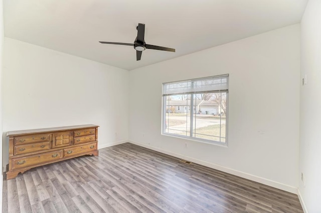 unfurnished room featuring light hardwood / wood-style flooring and ceiling fan