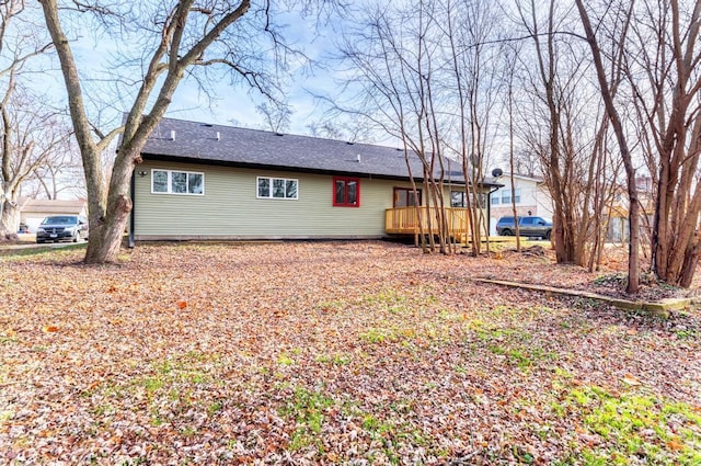 rear view of house with a wooden deck