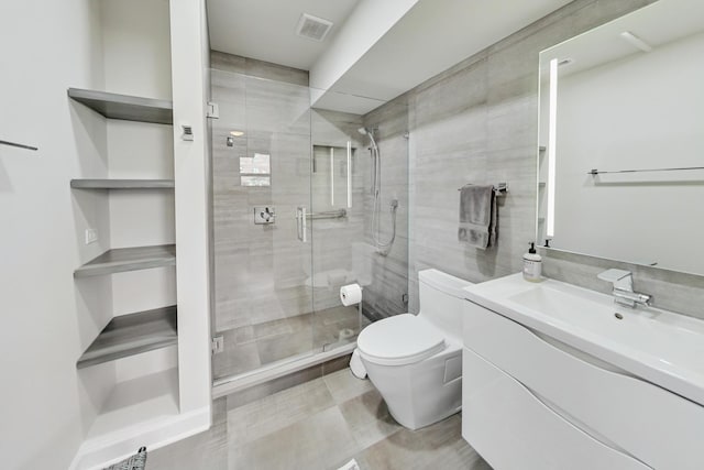 bathroom with vanity, toilet, and walk in shower