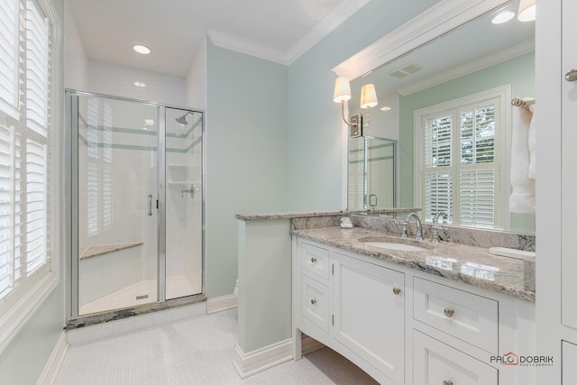 bathroom with crown molding, vanity, tile patterned floors, and walk in shower