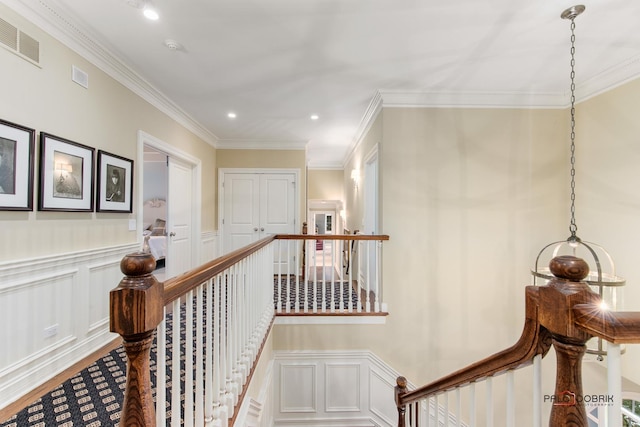 hallway featuring ornamental molding