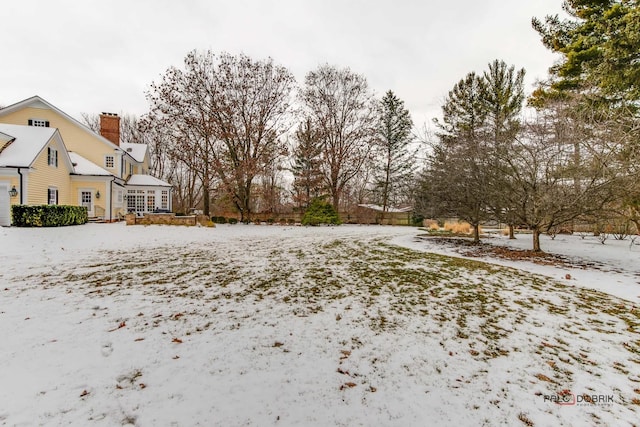 view of yard layered in snow