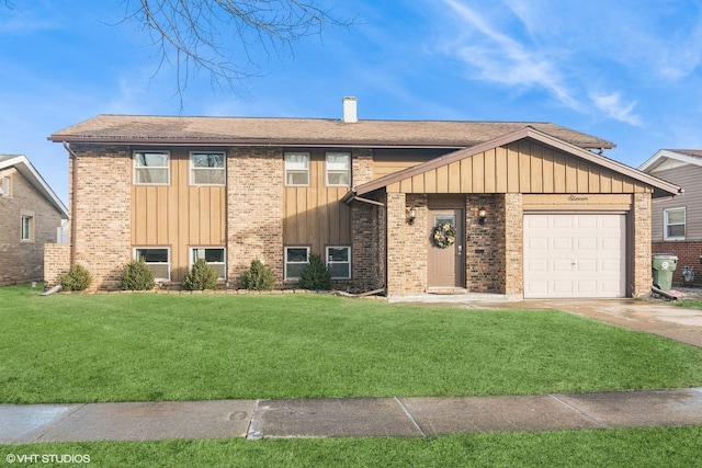 view of front of home with a garage and a front yard