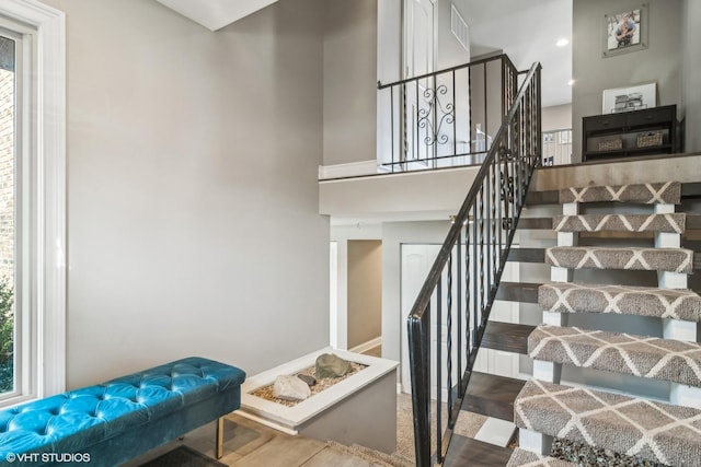 stairway with a high ceiling