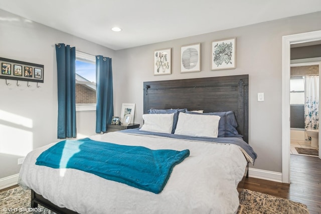 bedroom featuring dark hardwood / wood-style flooring