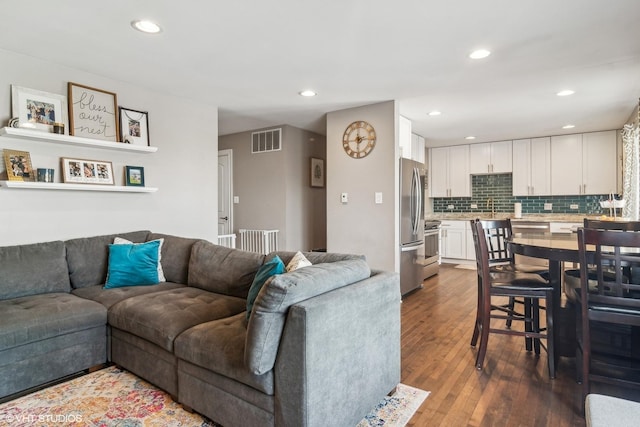 living room featuring dark hardwood / wood-style flooring