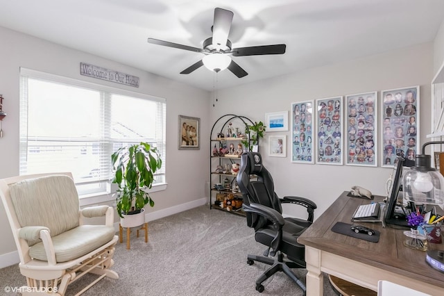 carpeted office with ceiling fan