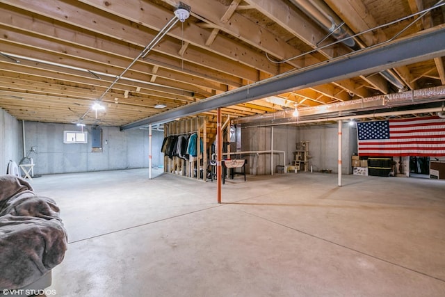 basement featuring electric panel