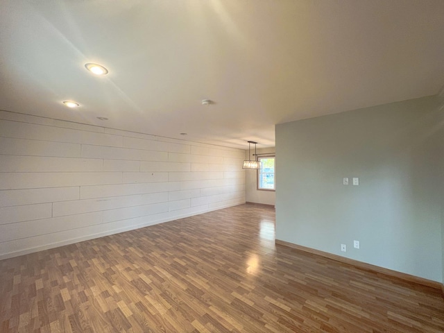 spare room featuring hardwood / wood-style floors