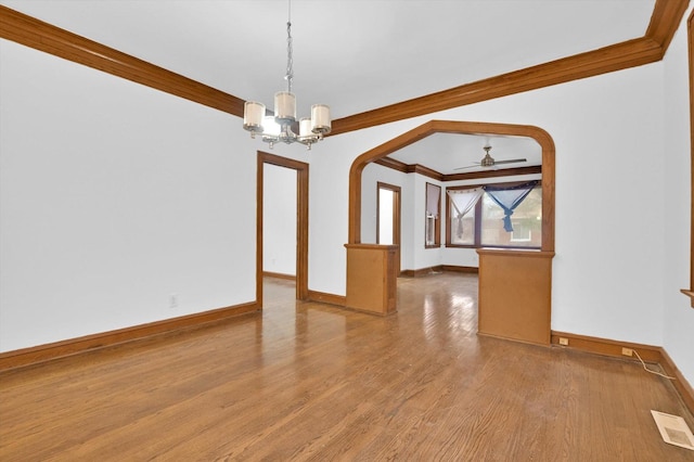 interior space with crown molding, hardwood / wood-style floors, and ceiling fan with notable chandelier