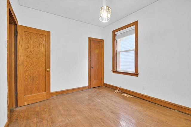 spare room featuring light hardwood / wood-style floors