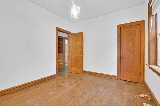 unfurnished room with light wood-type flooring