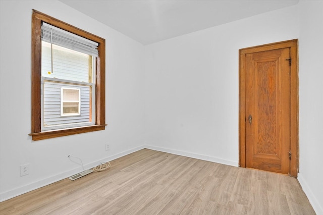 empty room with light wood-type flooring