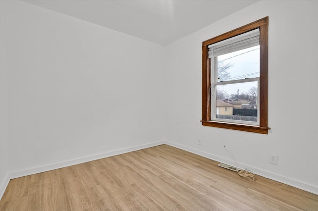 unfurnished room with light hardwood / wood-style flooring