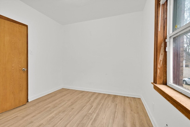 spare room featuring light wood-type flooring