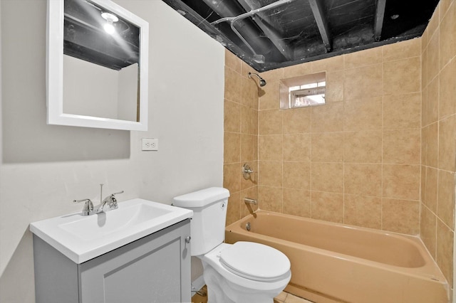 full bathroom with vanity, toilet, and tiled shower / bath