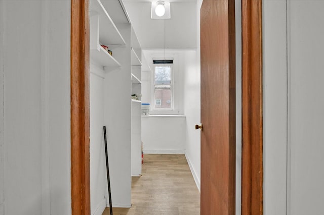 hallway with light wood-type flooring