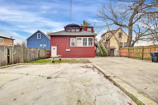 rear view of property featuring a patio