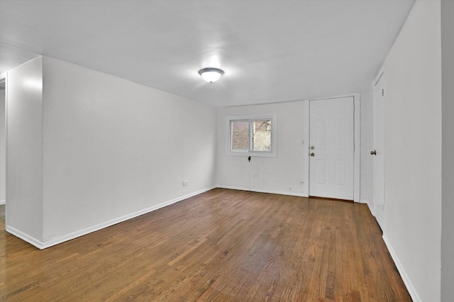 spare room featuring wood-type flooring