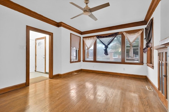 interior space featuring light hardwood / wood-style flooring, ceiling fan, and ornamental molding