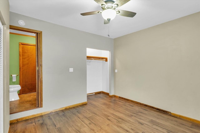 unfurnished room featuring ceiling fan and light hardwood / wood-style floors